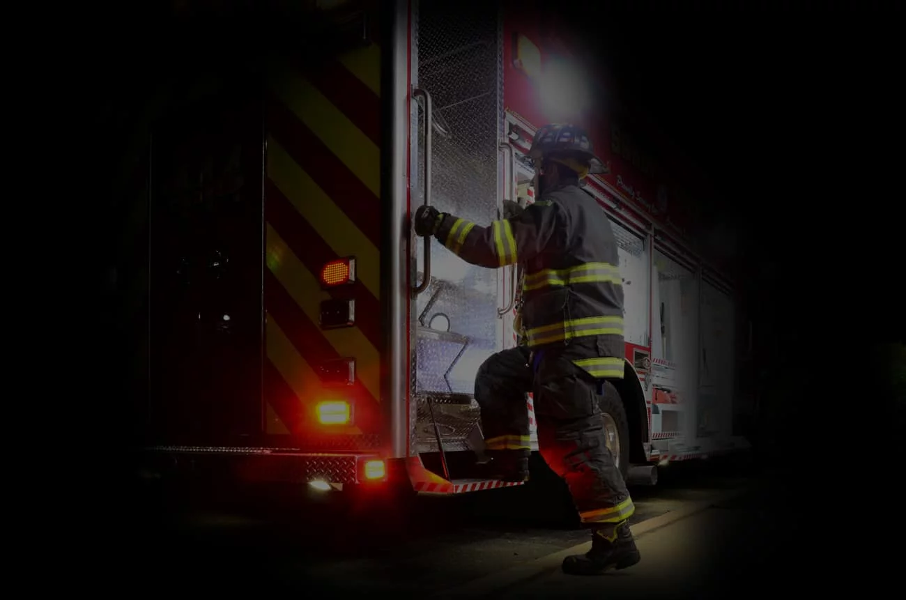 Fire fighter Stepping-in in a fire truck